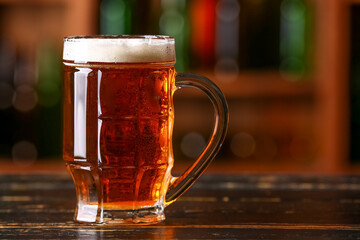 Mug of beer on table in bar. Oktoberfest celebration