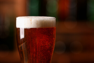 Glass of beer in bar, closeup. Oktoberfest celebration