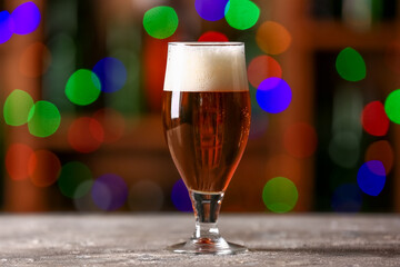 Glass of beer on table in bar. Oktoberfest celebration