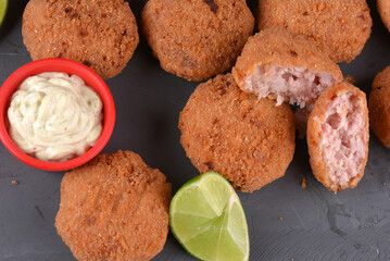 Fried and breaded codfish cake, fish empanadas, codfish cake, Brazilian-style codfish cakes, meat disc