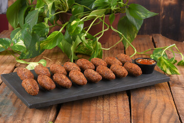 Fried and breaded codfish cake, fish empanadas, codfish cake, Brazilian-style codfish cakes, meat disc