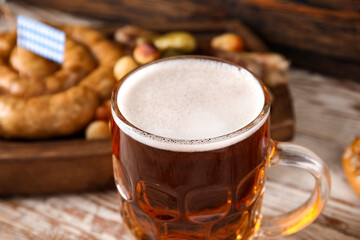 Mug of cold beer on table. Oktoberfest celebration