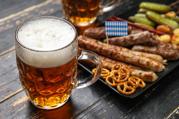 Mug of cold beer on dark wooden background. Oktoberfest celebration