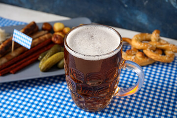 Mug of cold beer on table. Oktoberfest celebration