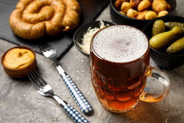 Mug of cold beer on grunge background. Oktoberfest celebration