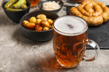 Mug of cold beer on grunge background. Oktoberfest celebration