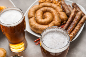 Glasses of cold beer on grey background. Oktoberfest celebration