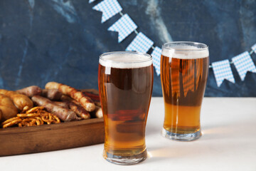 Glasses of cold beer on table. Oktoberfest celebration