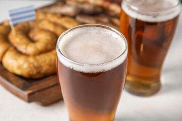 Glass of cold beer on light background. Oktoberfest celebration