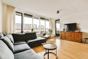 a living room with wood flooring and large windows looking out onto the cityscapeatrooms com