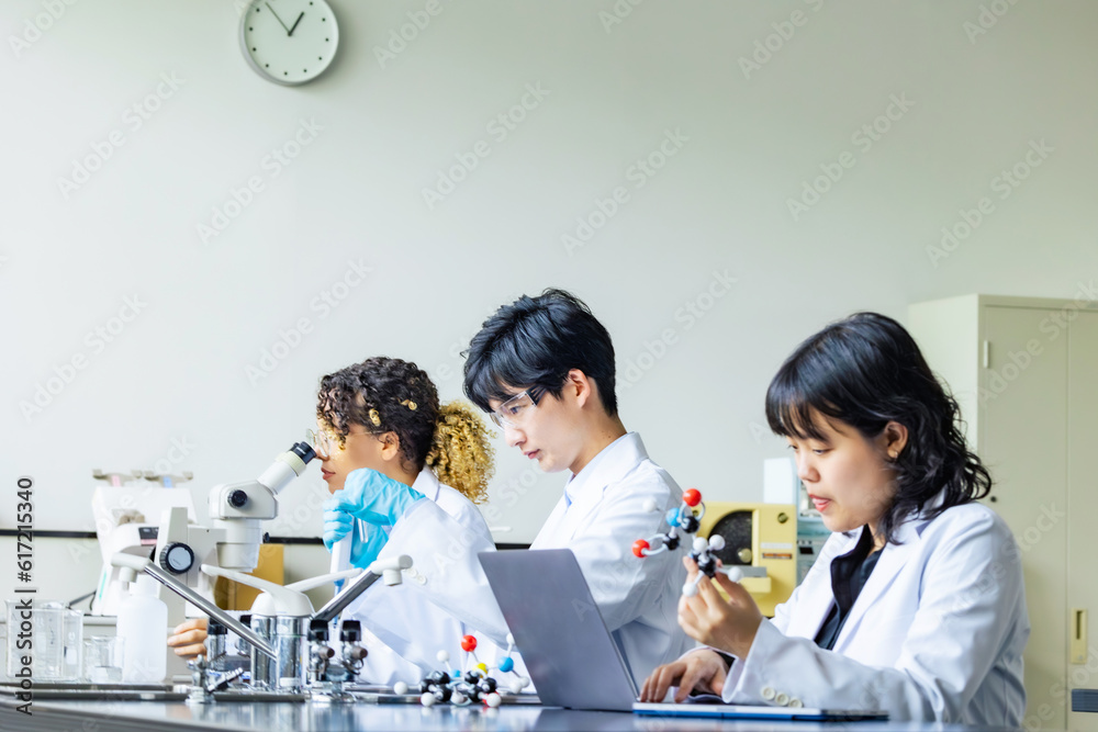 Poster multinational researcher group experimenting in the lab.
