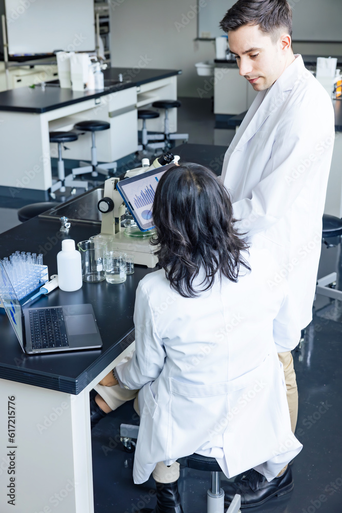 Poster Multinational researcher group experimenting in the lab. Research and Development.