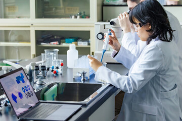 Multinational researcher group experimenting in the lab. Research and Development.