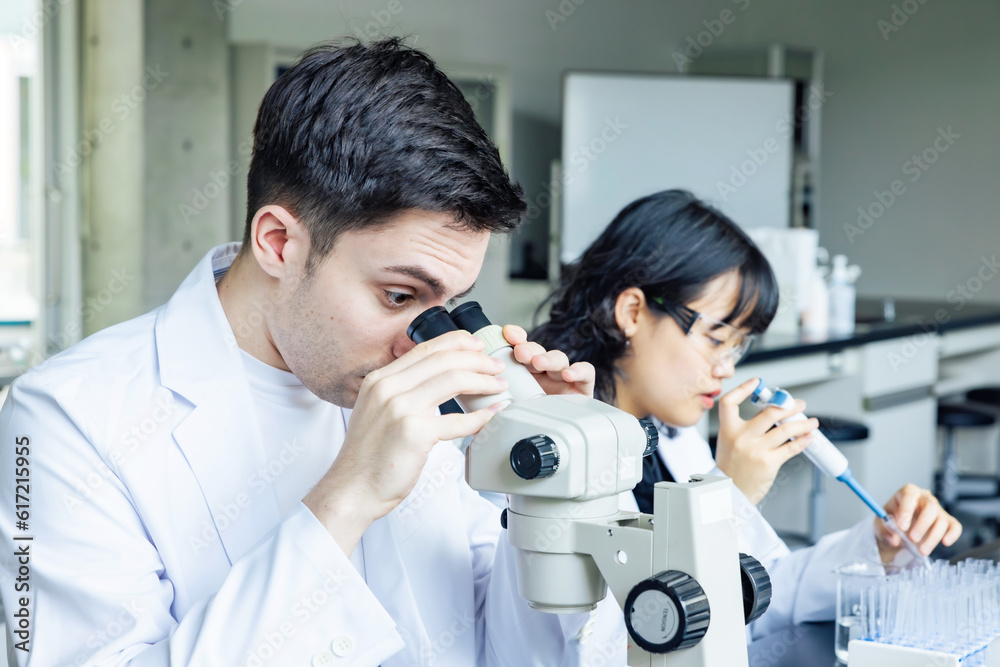 Poster multinational researcher group experimenting in the lab. research and development.
