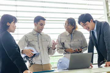 Group of multinational engineers and business people meeting in a building. International business.