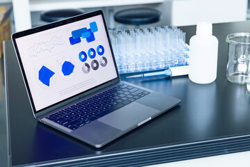 Experiment equipment and laptop placed in a science lab.