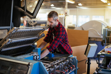 Mid adult man working in a printing press office