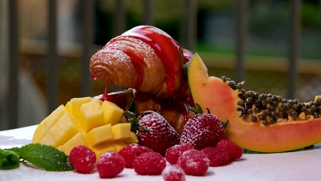 French Toas with strawberries and blueberries on top and drizzled with honey to sweeten the bread. High quality croissant