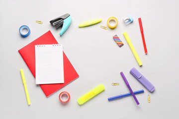 Notebooks with different school stationery on white background