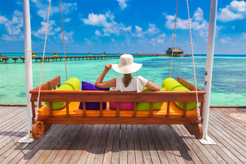 Woman on swing at beach