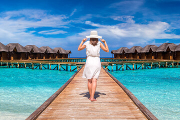 Woman standing on the wooden pier