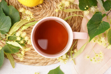 Cup of linden tea and lemon, closeup
