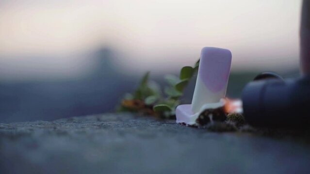 Blow torch used on soft candy that is standing up until it falls over