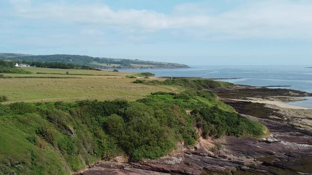 Traeth Lligwy eroded coastal shoreline aerial view scenic green rolling Welsh weathered Anglesey coastline