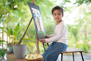 little asian girl happy with water color painting, Leisure activities when stay at home
