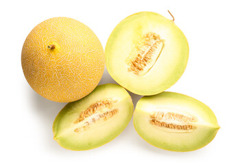 Half of sweet melon with pieces on white background