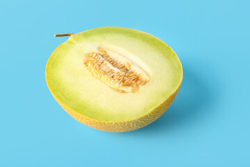 Half of sweet melon on blue background