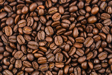 Close-up brown coffee beans background.
