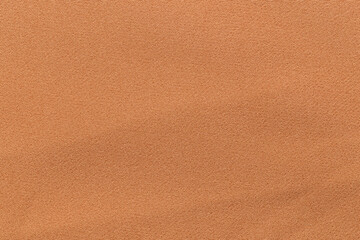Slightly desaturated orange color fabric cloth polyester texture and textile background.