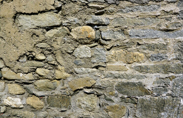 The old walls were made of stone and plastered with clay.