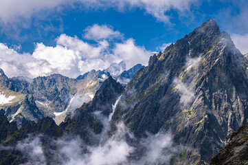 An outstanding mountain landscape of the High Tatras. A view from the Lomnicka Pass to the Prostredny Hrot.