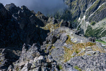 Obraz premium An outstanding mountain landscape of the High Tatras. A view from the Lomnicka Pass to the Little Cold Valley. Mala Studena Dolina, Slovakia.