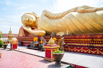 reclined buddha statue at wat that luang, vientiane