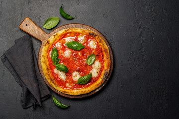 Margarita pizza with tomatoes, mozzarella cheese and basil