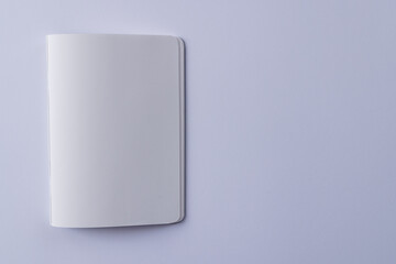 Close up of white notebook with copy space on white background