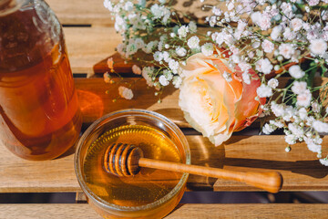 honey and flowers on the table
