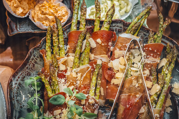 Beautifully arranged asparagus wrapped in prosciutto ham