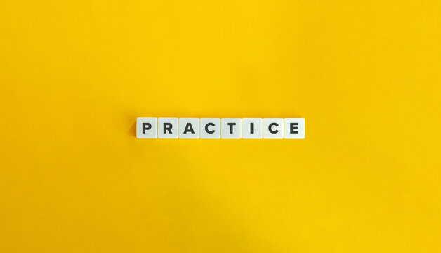 Practice Word on Block Letter Tiles on Yellow Background. Minimal Aesthetic.