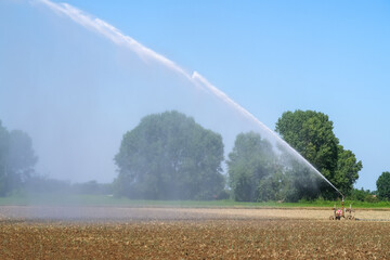Irrigation countryside agriculture jet water wetting field cultivation panorama