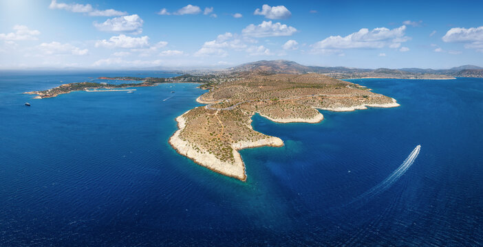 Panoramic aerial view of the Vouliagmeni Park in south Athens, Greece, with Limanakia bays and Varkiza town in the background