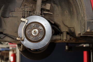 Breakdown vehicle disc break part at repair garage station. Concept of car center repair service.