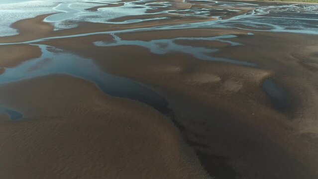 Coastal Pilbara region of Australia tidal mud flats and ocean. Abstract aerial drone patterns and shapes Cossack 4K