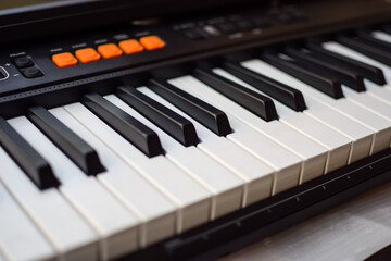 Close-up of piano keys. Piano black and white keys and Piano keyboard musical instrument placed at the home balcony during sunny day.
