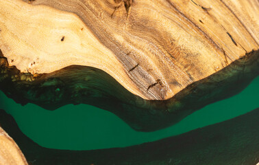 Texture of a wooden table with epoxy resin. Burl elm, wood texture