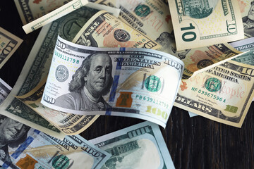 Money, US dollar bills background. Money scattered on the desk. Photography for Finance and Economy concepts.