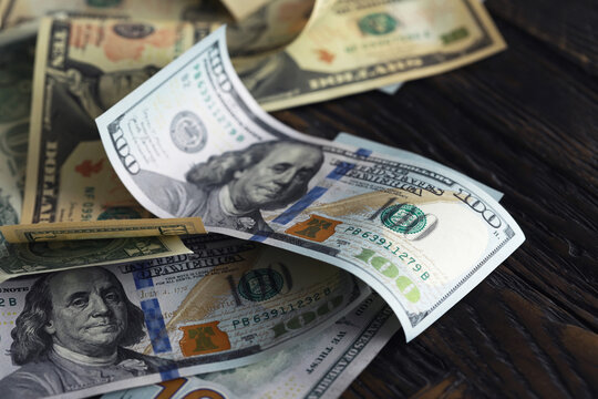Money, US dollar bills background. Money scattered on the desk. Photography for Finance and Economy concepts.